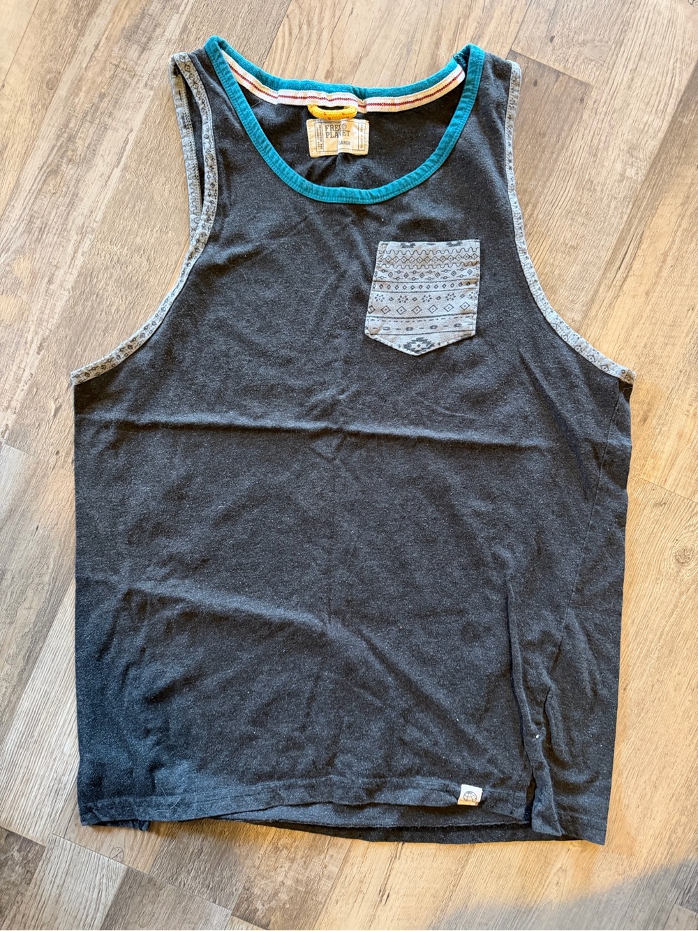 Free Planet Black Tank Top with Patterned Gray Pocket and Teal Trim